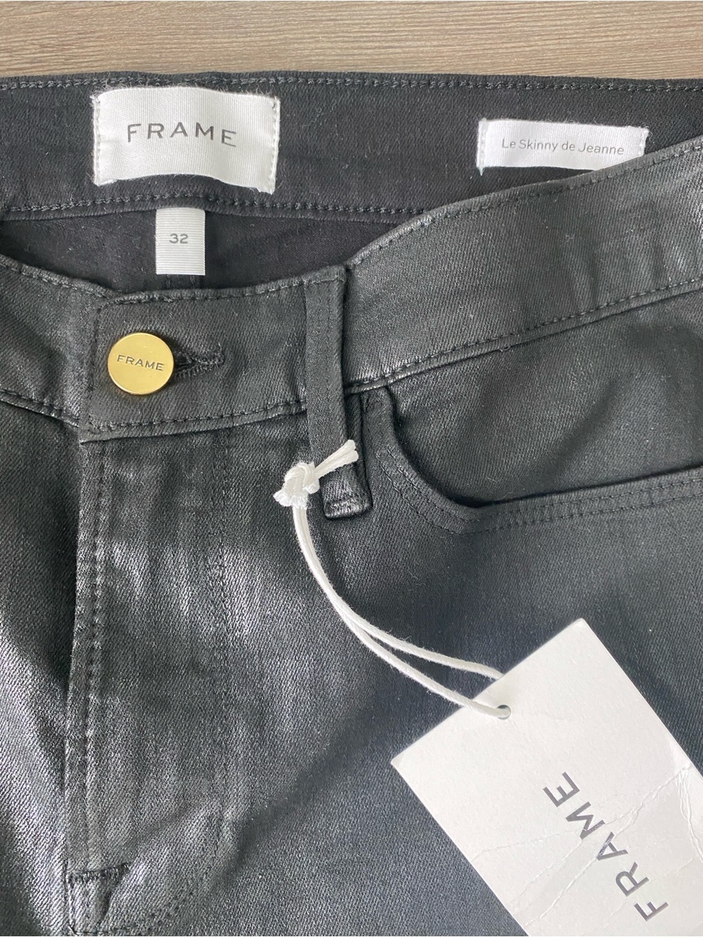 Frame Denim Black Coated Skinny Jeans with Gold Button